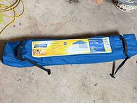 Full view of blue Broadstone carry bag holding gazebo