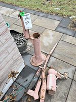 Pedestal and loose pump parts on ground