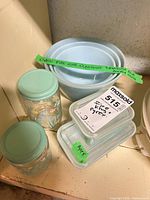 Overall view of bowls, refrigerator dishes with lids, and storage jars