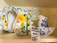 Shelf view showing Italian floral pitcher, Italian platter edge, and Alfred Meakin basin with pitcher