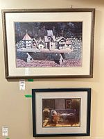 Both framed prints on wall showing relative size and frames