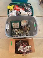 Overview of three containers with ornaments, boxed lights and accessories
