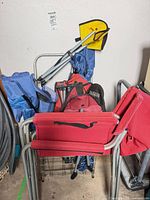 Folded chairs, stool, pet pad grouped together