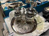 Full view of three-piece silver-plated set on tray