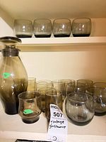 Full set on shelf showing decanter and all glasses