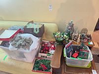 Overview showing nativity, flocked tree, storage bins, tinsel boxes, centerpiece