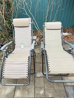 Front view of both loungers showing fabric and headrests