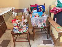 Front view of both wooden spindle-back chairs (contents on seats ignored)