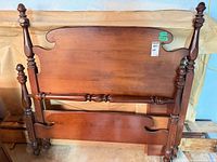 Headboard and footboard leaning together showing overall design and finish