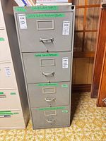 Front view showing four drawers and gray finish