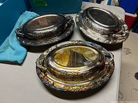 Three covered serving dishes showing size and condition