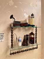 Shelf with seven novelty cologne/aftershave bottles displayed
