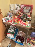 Overall view of square folding card table with holiday items on top