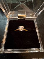 Ring in display box showing diamond and band