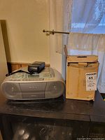 Sony CFD-S01 boombox, VTech phone handset on top, VTech box beside