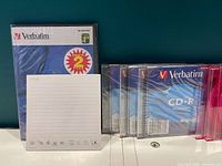 All discs displayed upright, including sealed DVD-R pack and assorted CD-R cases