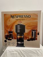 Factory-sealed box front showing Nespresso Vertuo Next model and imagery