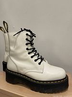 side view of boots showing uppers, laces and platform sole