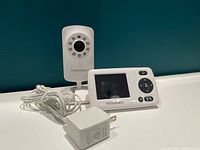 Camera unit, monitor and power adapter displayed front-on