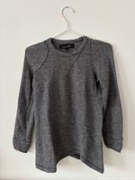 Full view of grey Isabel Marant sweater on hanger front facing