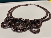 Front view showing knotted focal and mesh texture