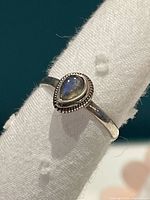 Front view of silver ring with teardrop moonstone