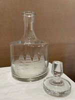 decanter and stopper separated, showing etched ship design and stopper shape