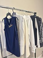 Front view of all six garments on rack