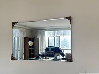 Full view of rectangular wall mirror mounted horizontally