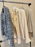 Three jackets on rack showing overall lot