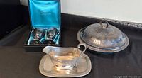 Group photo of goblets in box, gravy boat with tray, covered dish