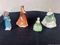 Group shot of 4 Royal Doulton figurines