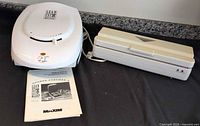 George Foreman grill, manual, vacuum sealer together