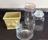 Group shot of ceramic planter, glass dish and two glass jars