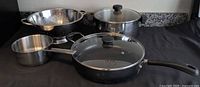 Overall lot showing sauté pan, two pots and colander