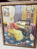 Full view of tapestry in frame showing scene and frame detail