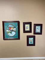 overall view showing four framed bird pictures on wall