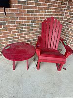 Adirondack chair and matching round table on patio