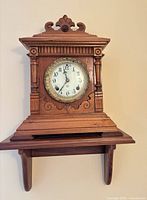 Front view of Ansonia Sharon mantle clock on shelf
