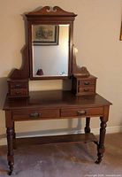Full view of antique dressing table showing mirror, drawers, legs