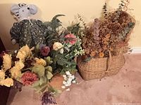 Both containers with floral arrangements visible together