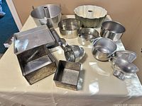 All bakeware and tools arranged on table