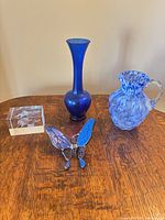 All four blue glass and crystal items grouped