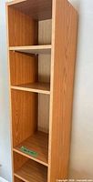 Close view of tall narrow bookcase