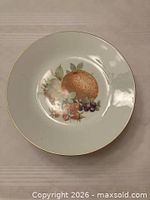 front view showing fruit design and gold rim