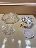 All items grouped: casserole with lid, dip chiller box and bowl, glass juicer