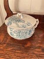 Chamber pot with lid showing blue floral pattern
