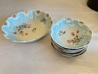 Serving bowl and stack of eight side bowls showing pattern and quantity