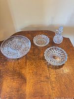 Group shot of all four cut glass items on table