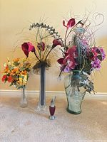 All five items lined up showing relative sizes and floral contents